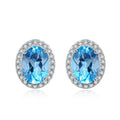 925 sterling silver jewellery set with blue topaz gems in geometric design including earrings, ring, necklace and pendant