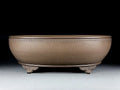 Handmade oval purple sand flowerpot in black mud green, measuring 50x39.5x16cm.