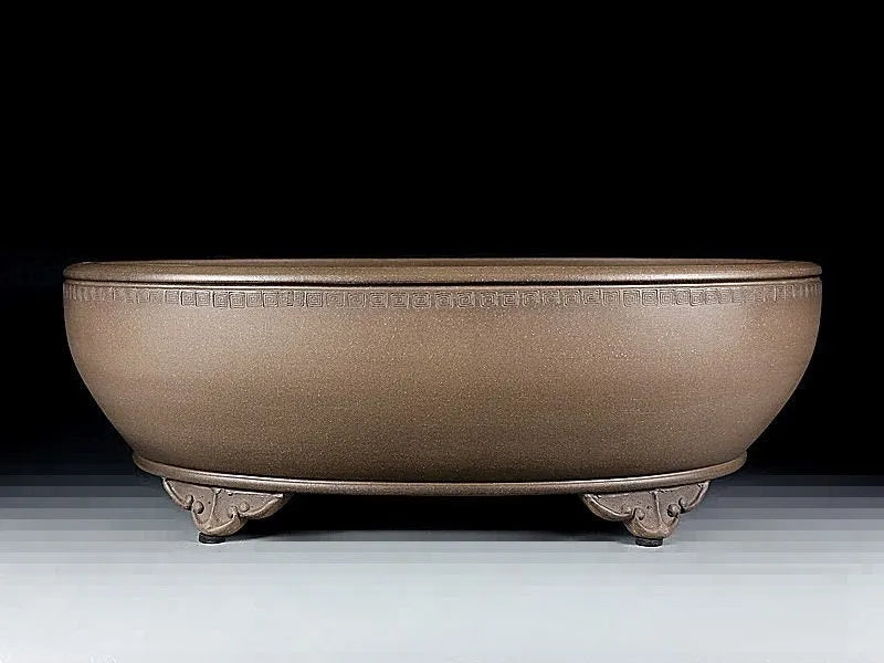 Handmade oval purple sand flowerpot in black mud green, measuring 50x39.5x16cm.