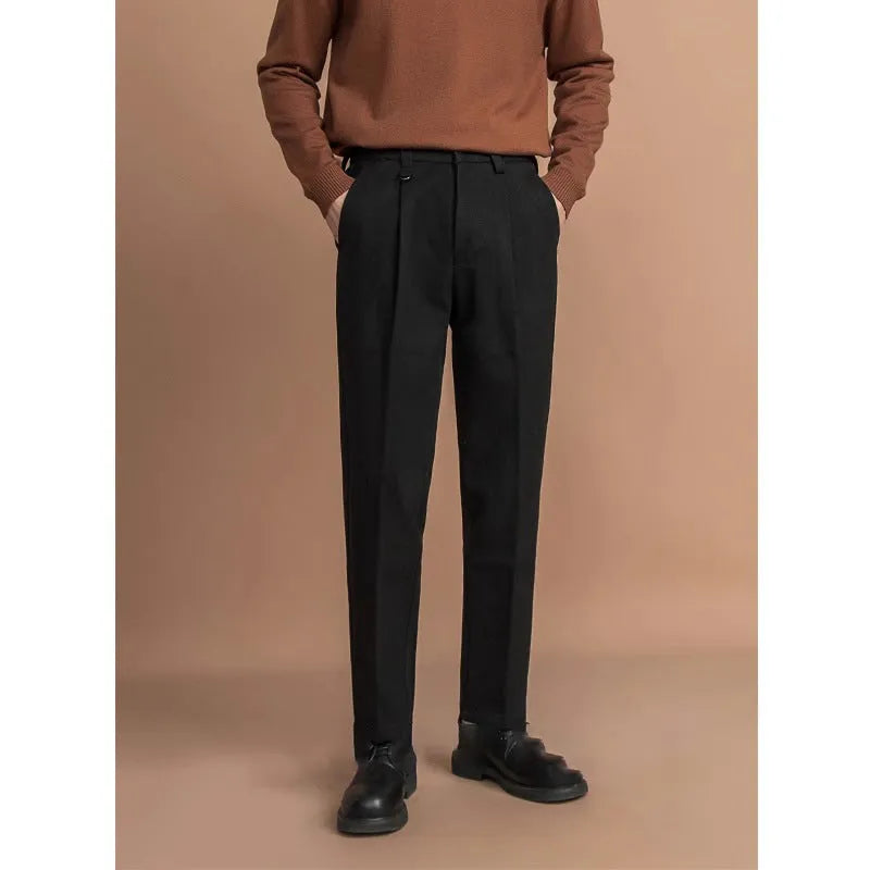 Men's straight-leg polyester trousers in black, shown in a business casual setting.