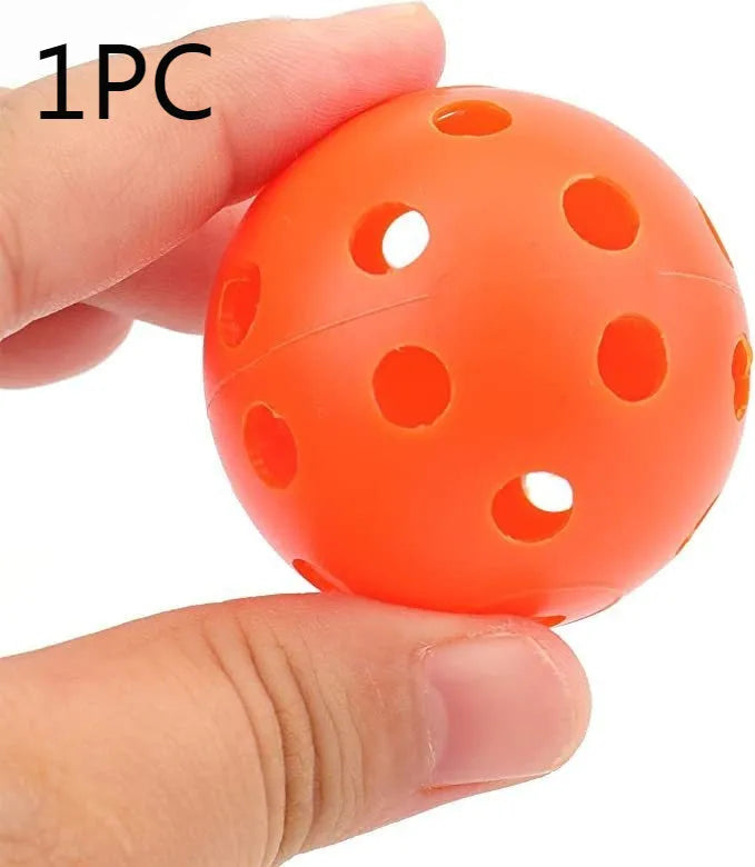 Multi-colour 42mm PE golf practice balls with 26-hole design in net pocket