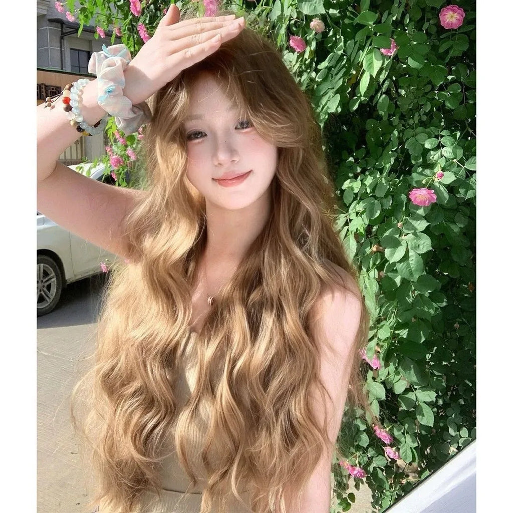Medium length curly synthetic wig in linen brown colour with defined curls and included hair net