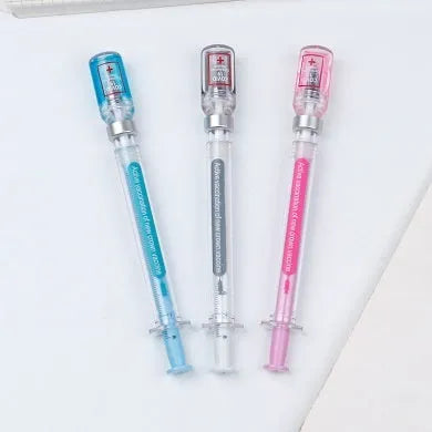 Creative vaccine-style gel pen with black cap, showing 15.7cm length and 0.5mm tip.