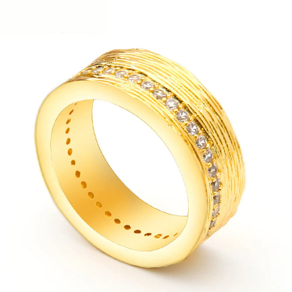 Gold geometric zircon ring for women on a white background.