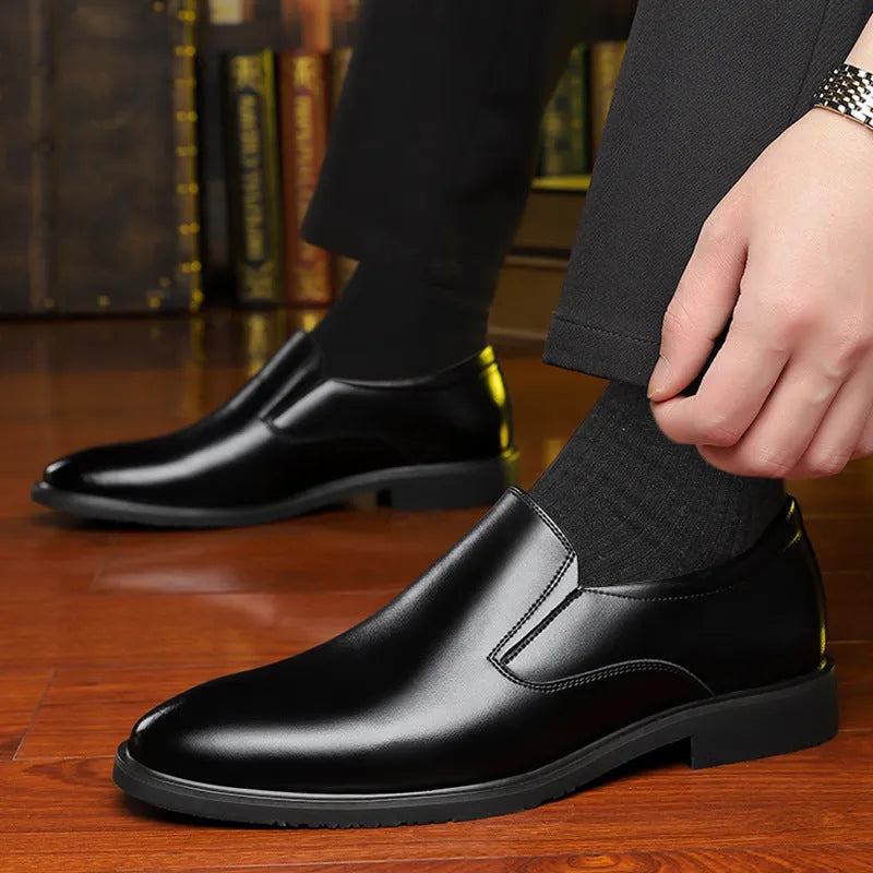 Men's black business casual slip-on shoes with a leather toe cap and sewing line detail.