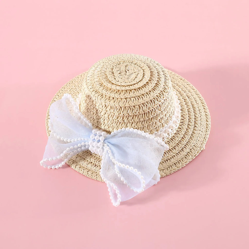 Woven straw hat for cats with pearl butterfly bow in princess style, shown in pink colour