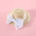 Woven straw hat for cats with pearl butterfly bow in princess style, shown in pink colour