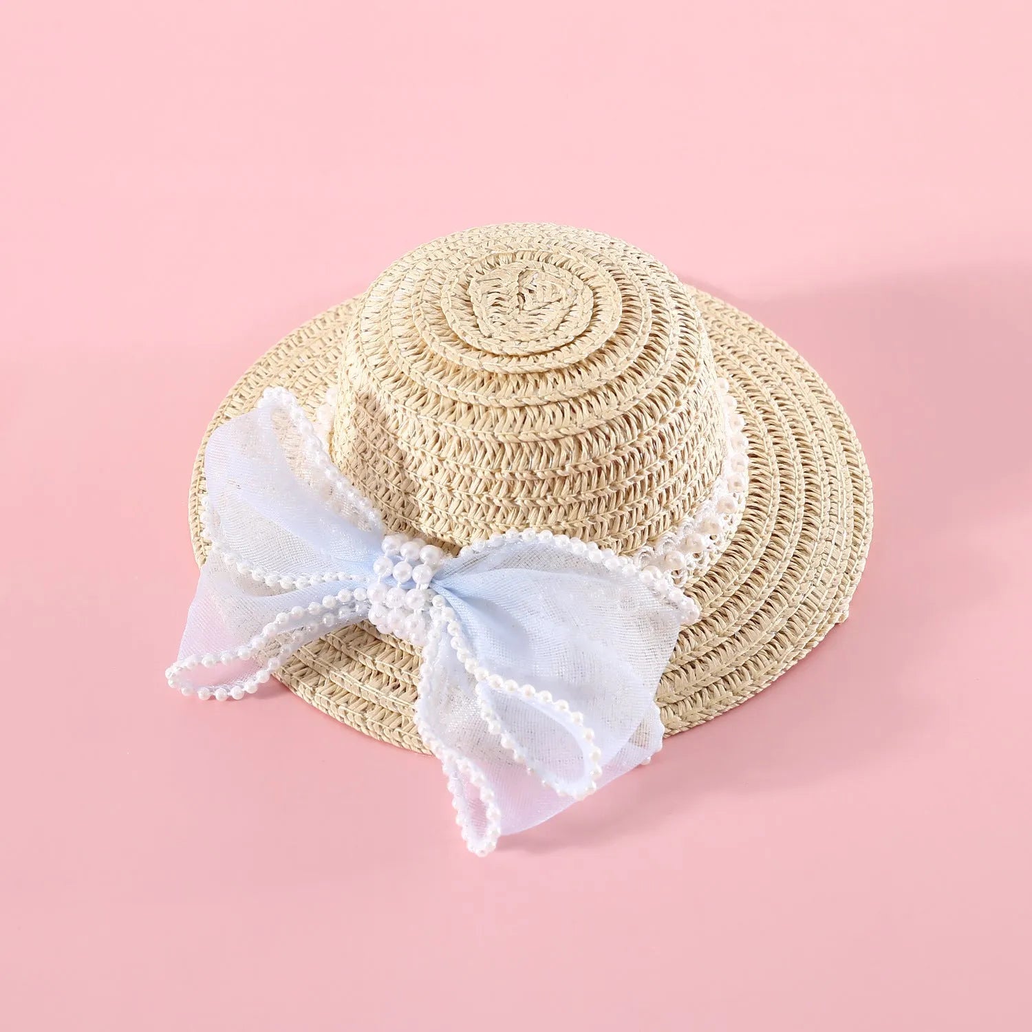 Woven straw hat for cats with pearl butterfly bow in princess style, shown in pink colour