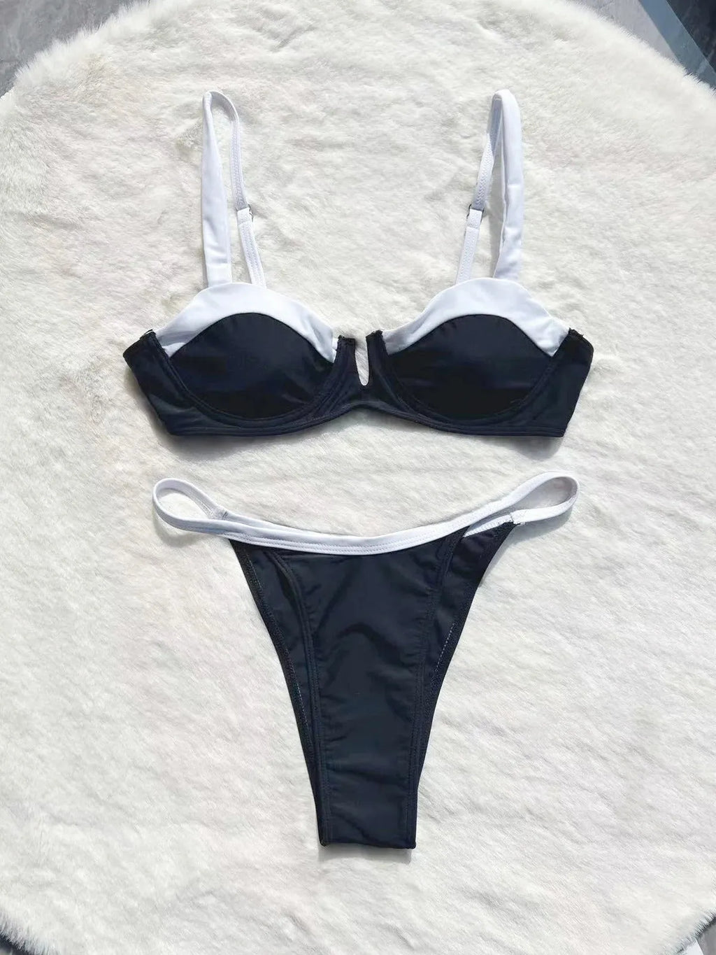Black women's low waist bikini swimsuit set with stitching detail on split briefs