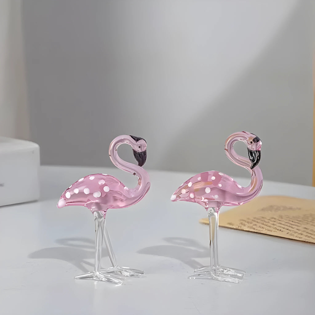 Pink flamingo crystal animal decoration on a tabletop in separate and juxtaposition styles.