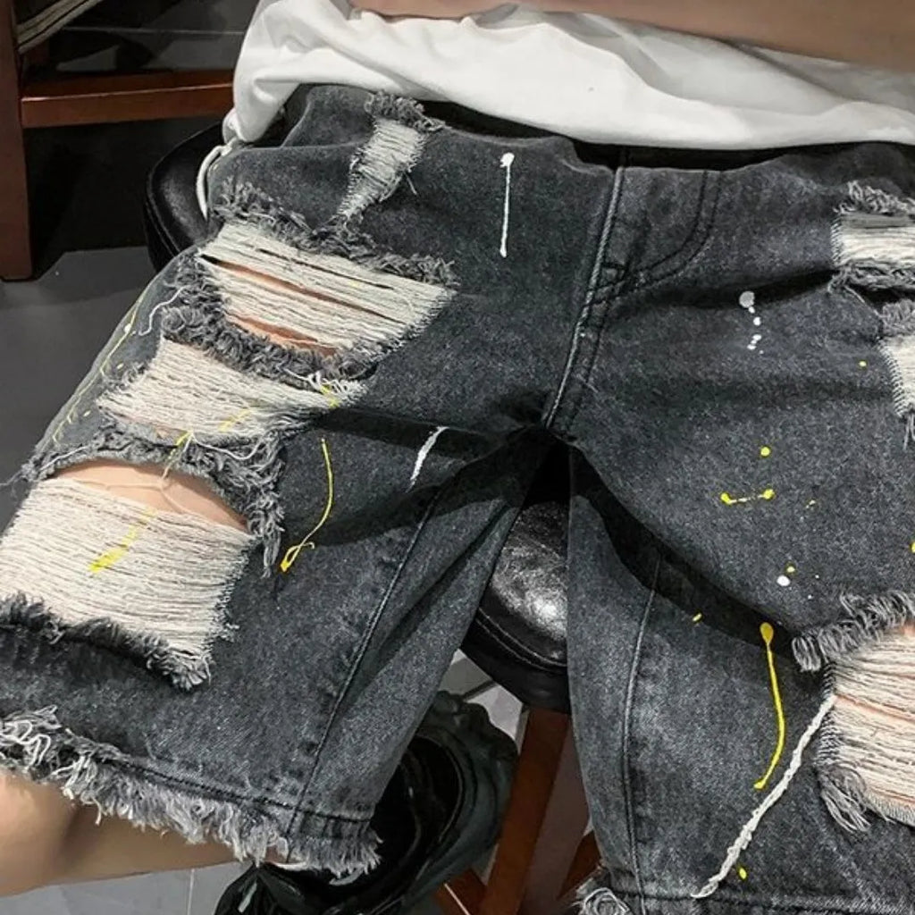 Men's casual denim shorts with water washed distressing and loose street style fit