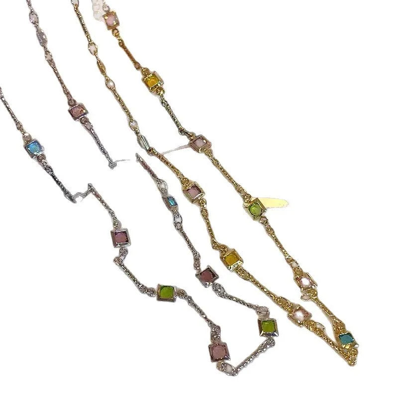 Square geometric clavicle chain necklace in gold or white K tone with alloy and artificial crystal.