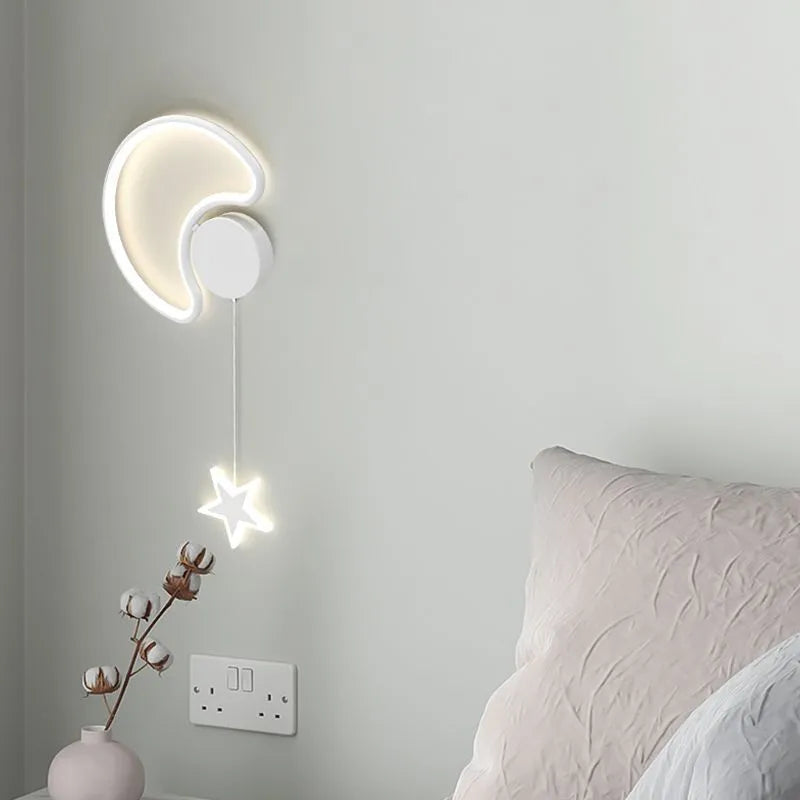 Cartoon cloud, moon and five-pointed star shaped bedside wall lamp for a children's bedroom in black or white.
