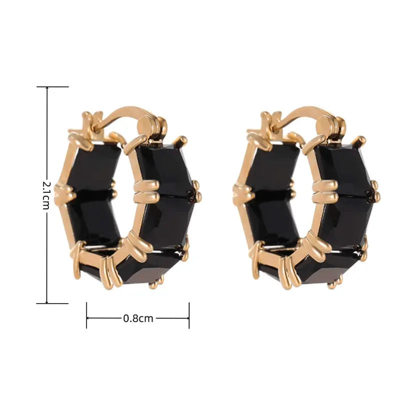 Geometric U-shaped earrings with round crystal zirconium stones in gold setting