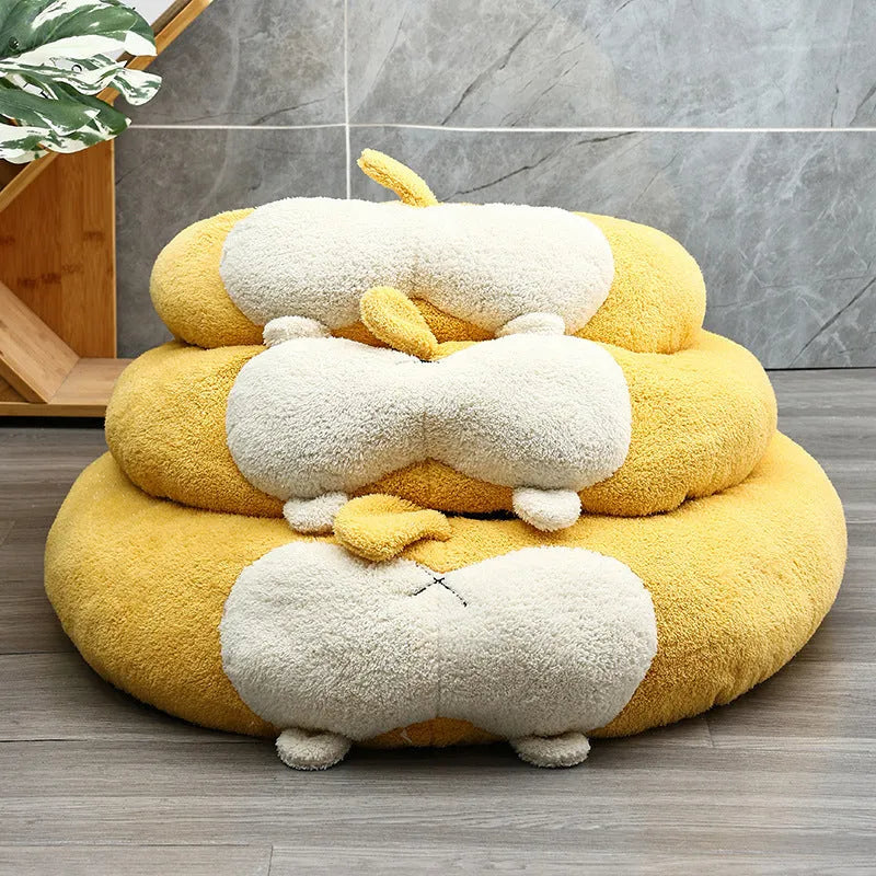 Brown and white corgi-shaped plush pet bed for dogs or cats on a wooden floor.