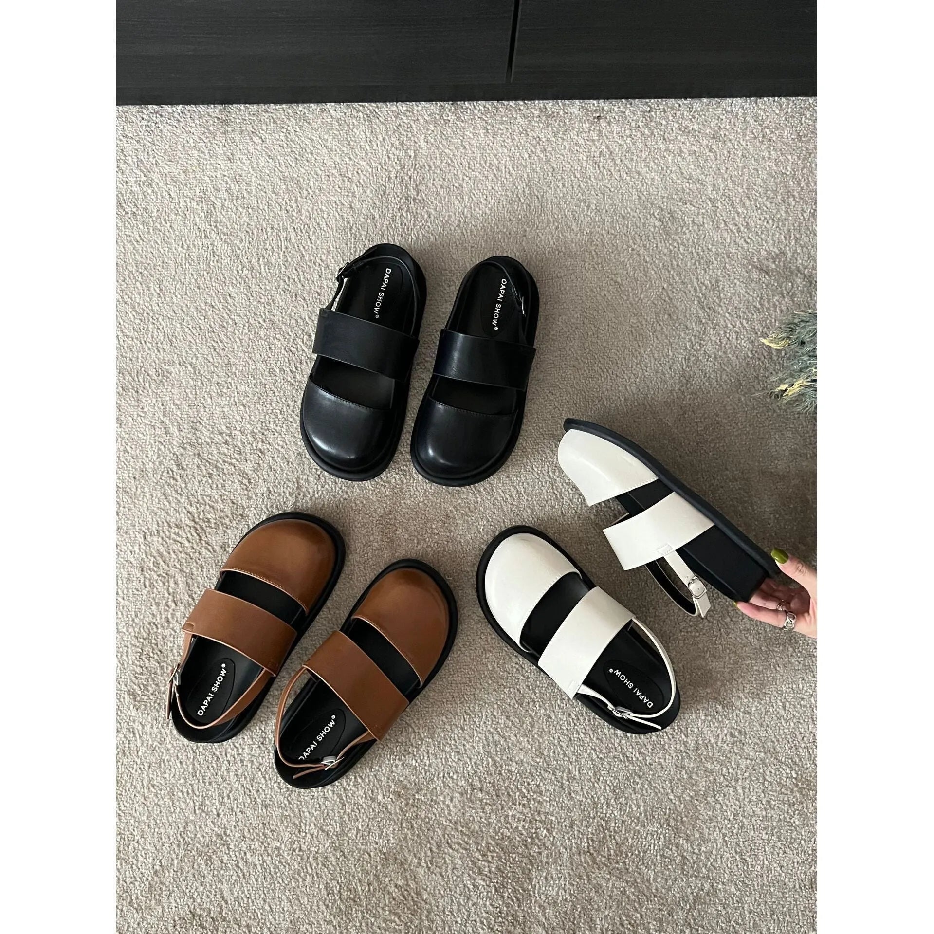 Retro brown platform sandals with a single ankle strap buckle and closed round toe.