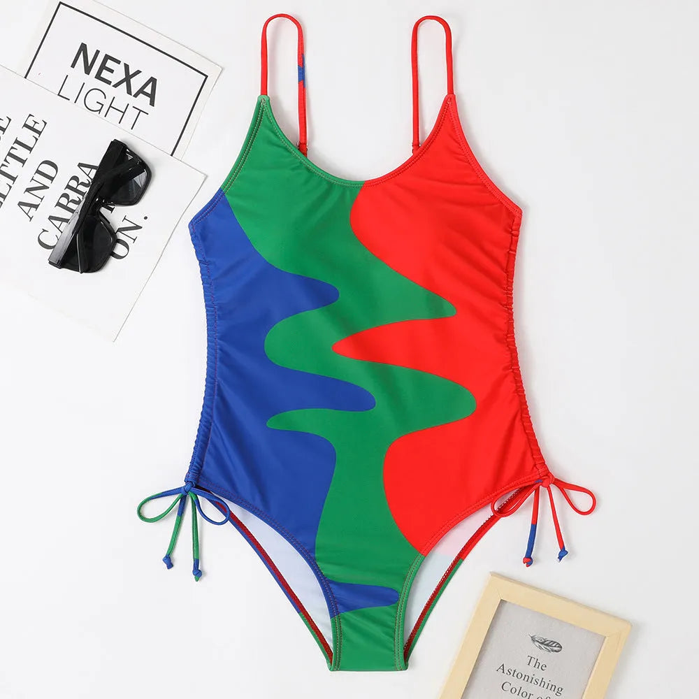 Women's blue sleeveless one-piece swimsuit with a striped pattern on a mannequin.