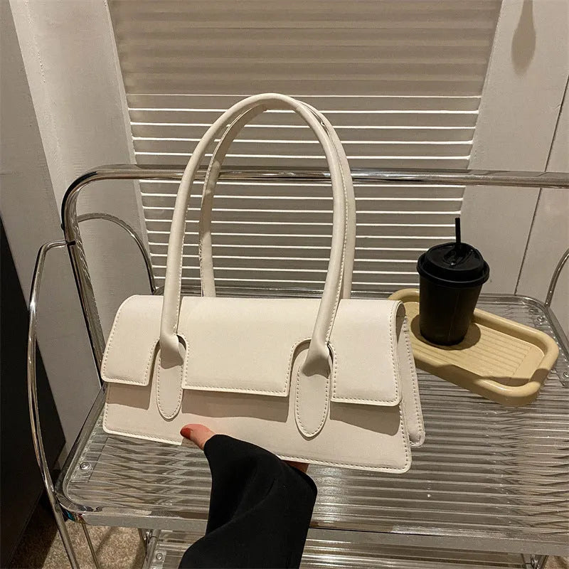 Women's small horizontal square shoulder bag in PU leather with visible stitching in a choice of colours