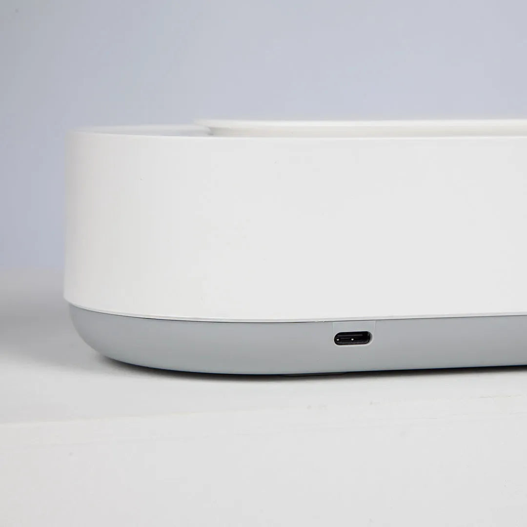 White portable ultrasonic cleaning machine with digital display and stainless steel tank.