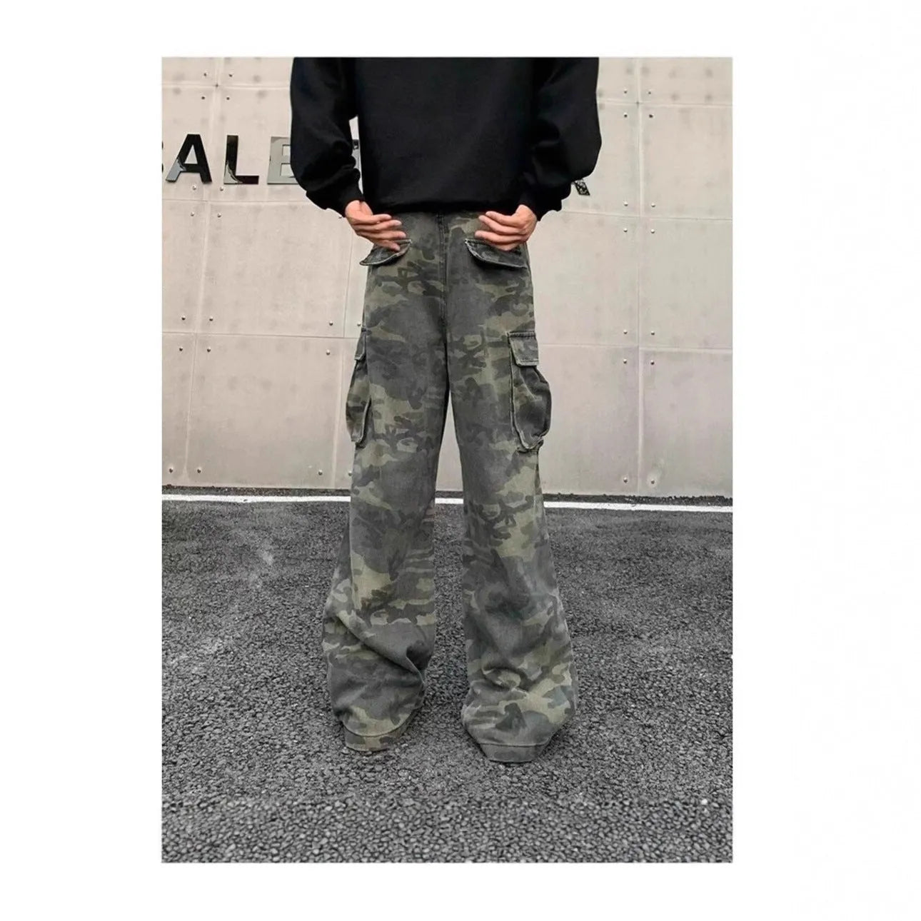 American vintage washed camouflage green cargo trousers with multiple pockets on a neutral background.