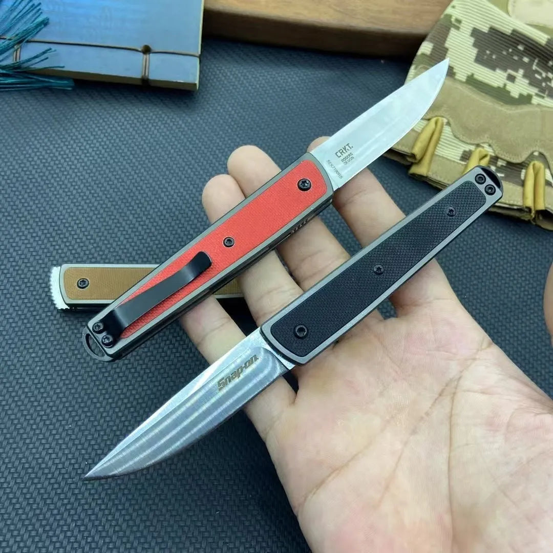 CRKT 7190 folding fruit knife showing blade and handle with colour options of black, brown, and red