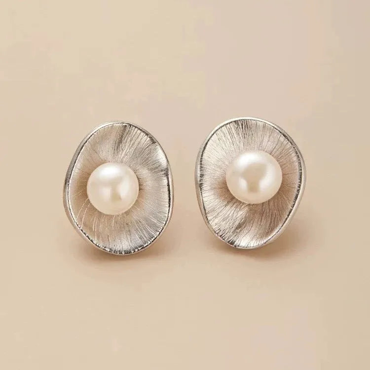 Pearl sterling silver needle earrings with geometric design and electroplated gold finish
