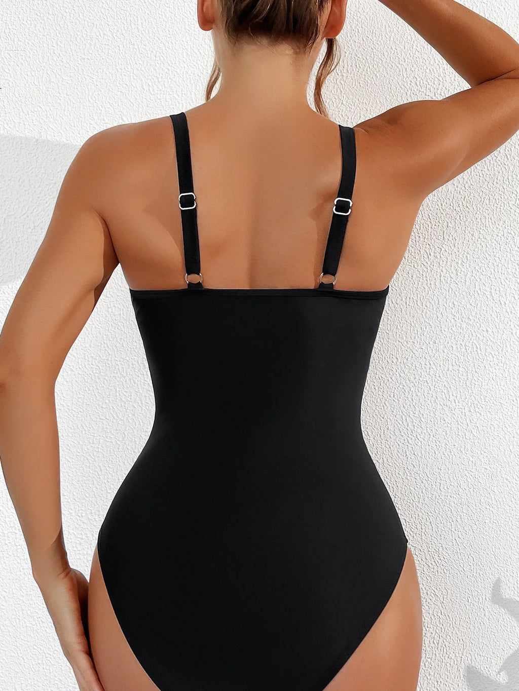 Black women's one-piece swimsuit with mesh halter neck and briefs style bottom.