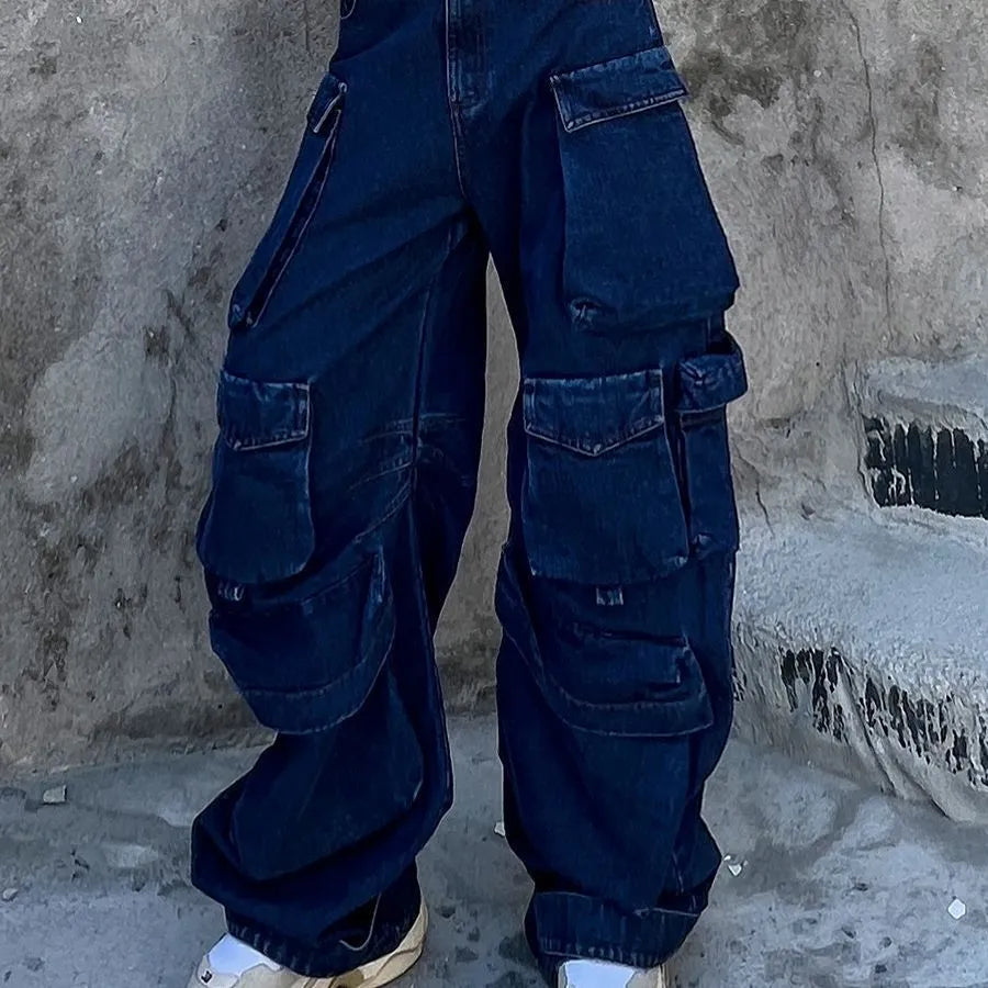Dark blue distressed wide-leg jeans with high waist, multiple pockets, and raw hem detail
