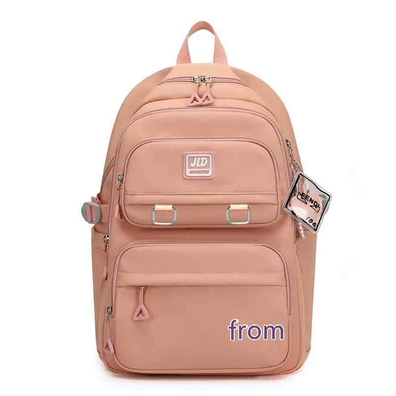 Girls' large capacity nylon school backpack with physiological curve backplate in various colour and print options.