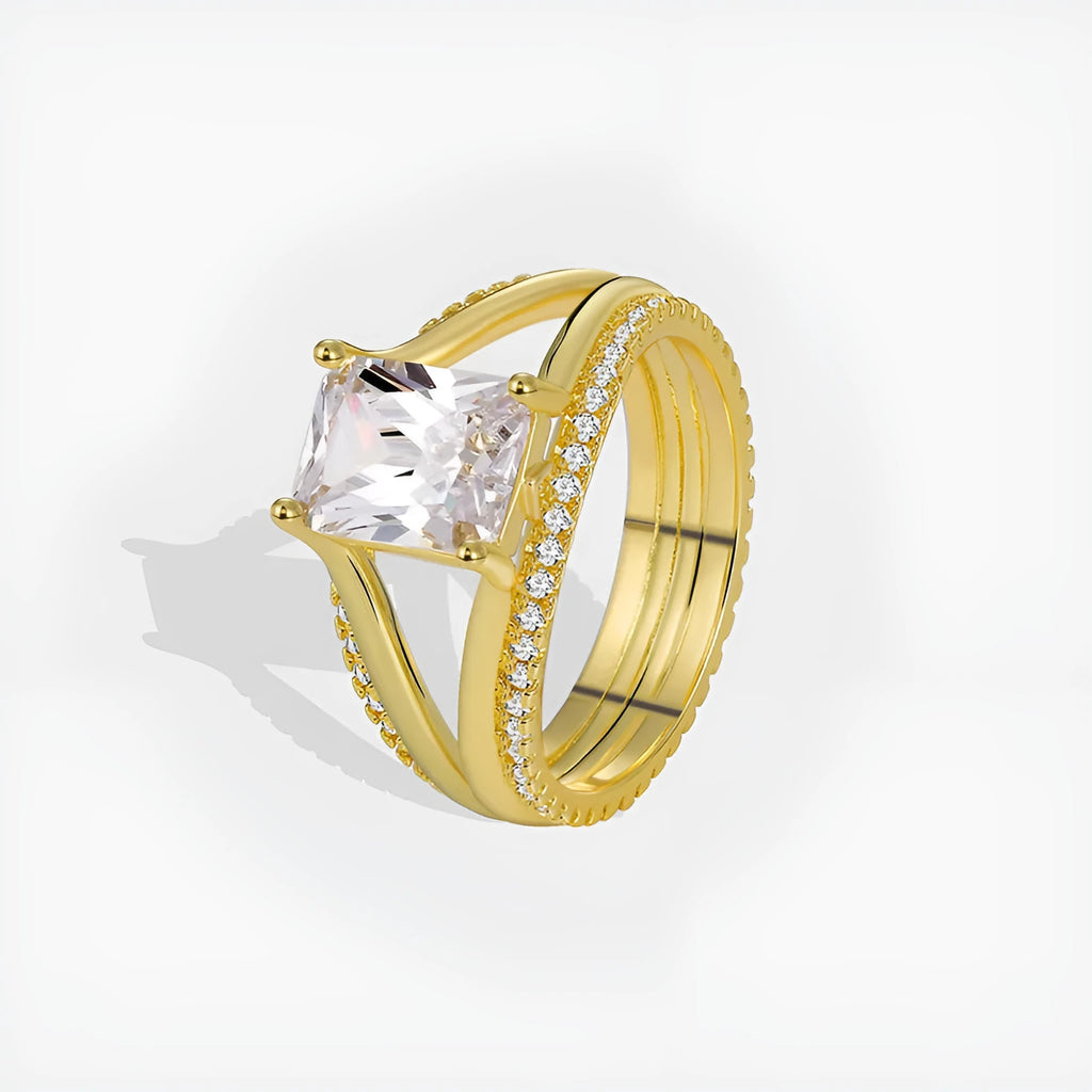 Gold geometric women's ring with a square zircon stone on a copper band.