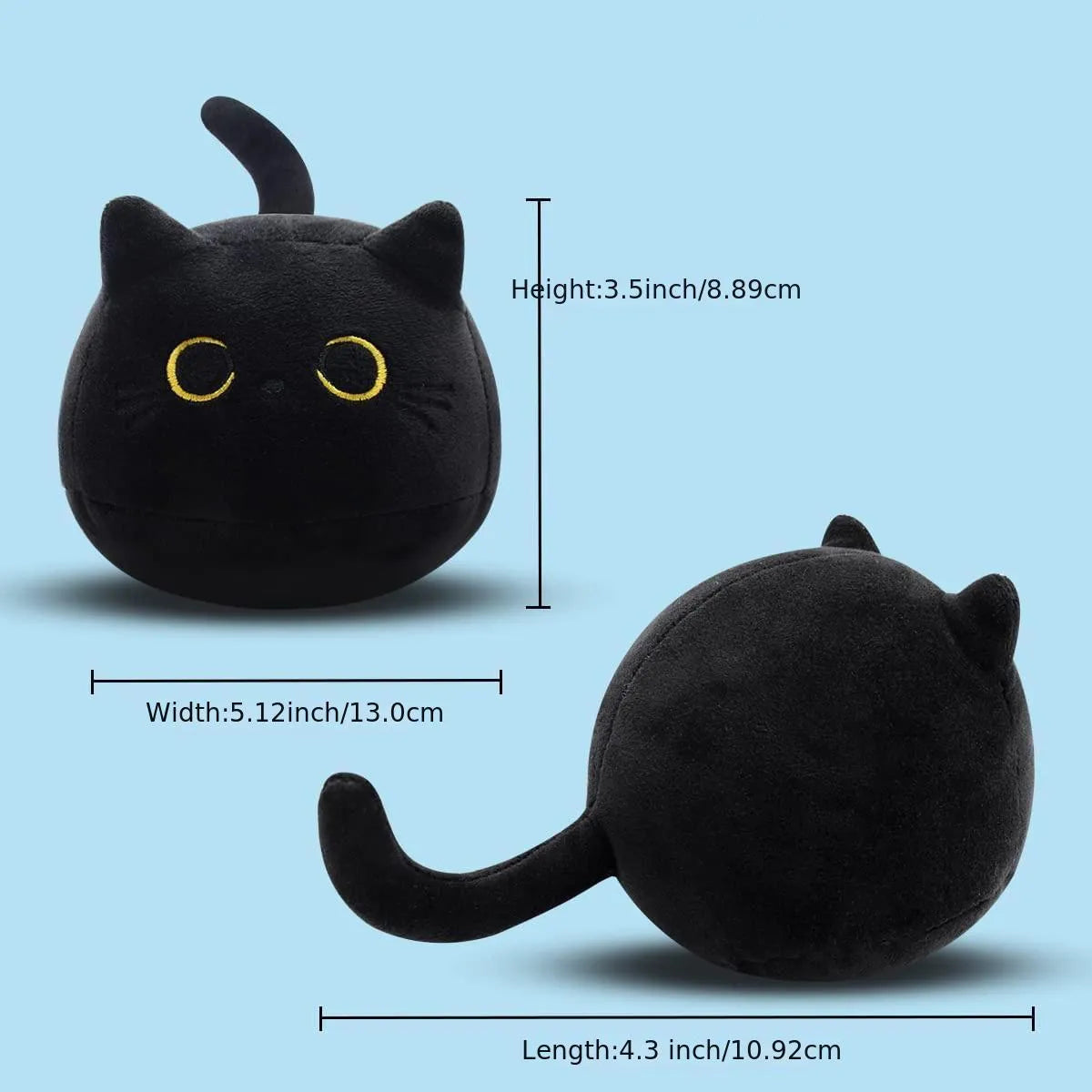 Fluffy black cat stuffed toy with embroidered eyes and whiskers on a grey background.