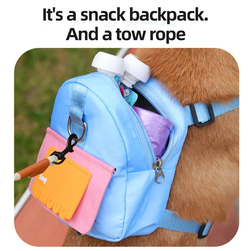 Blue adjustable dog backpack harness with storage compartments and a tow rope attached.