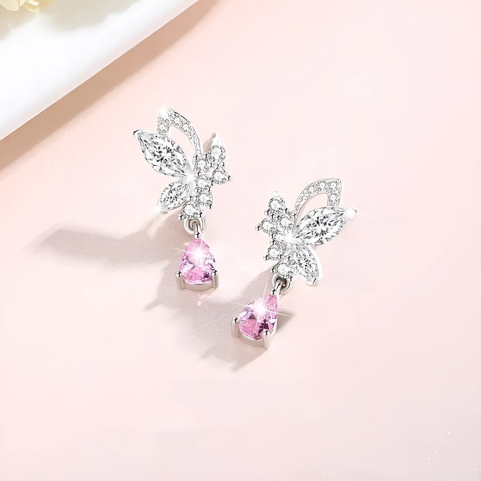 Butterfly crystal stud earrings in silver with decorative design