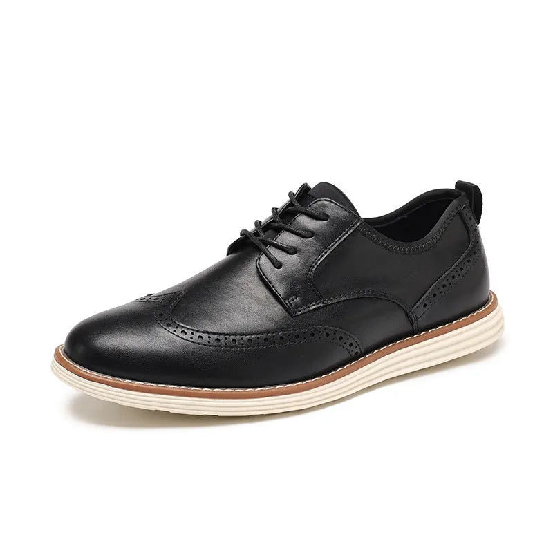 Men's black slip-on casual shoes with round toe and carving design on PU upper