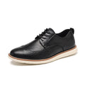 Men's black slip-on casual shoes with round toe and carving design on PU upper