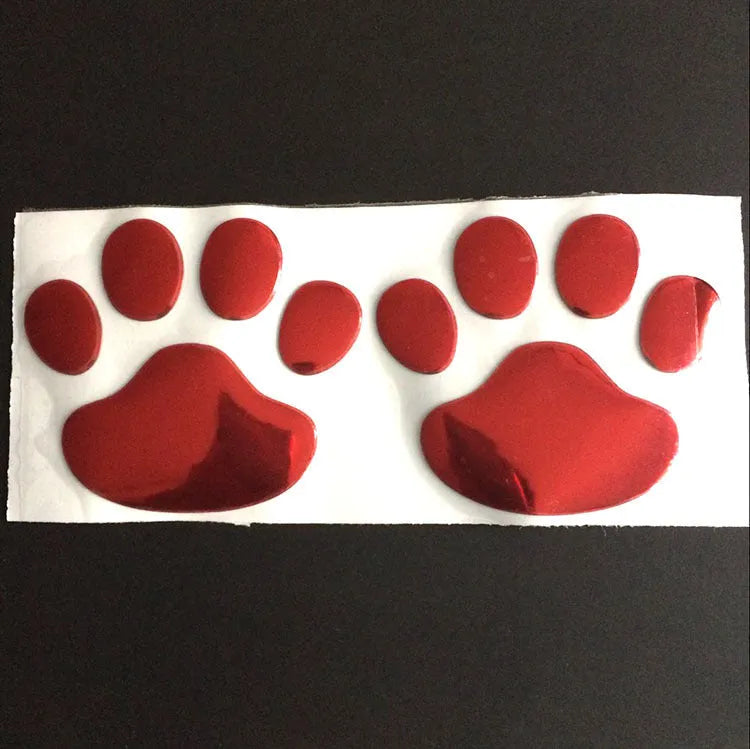 PVC car bumper sticker with hand-brushed dog footprints pattern in red, silver, gold, or black, 7cm long.