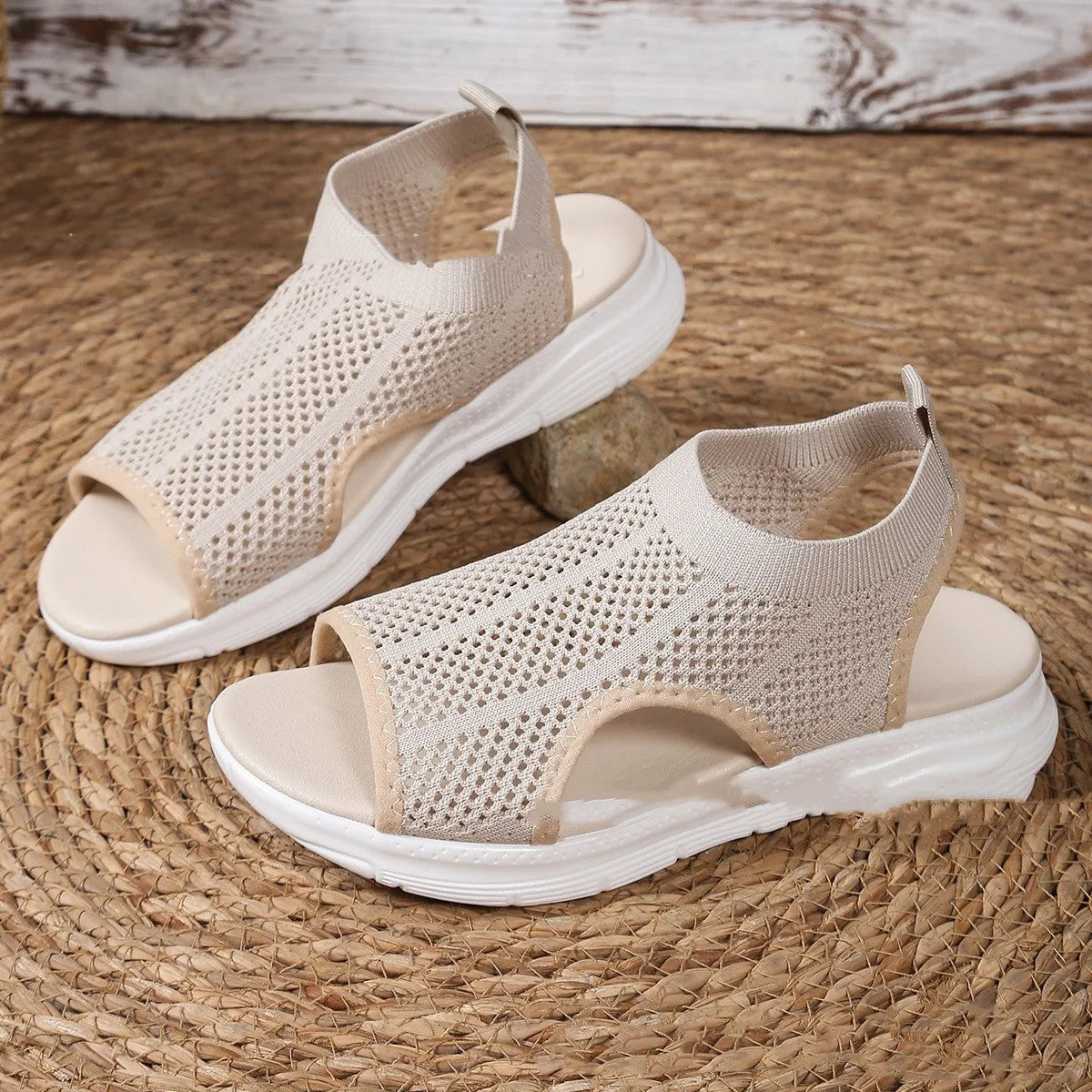 Women's flat black platform sports sandals with mesh lining and a thick rubber sole.