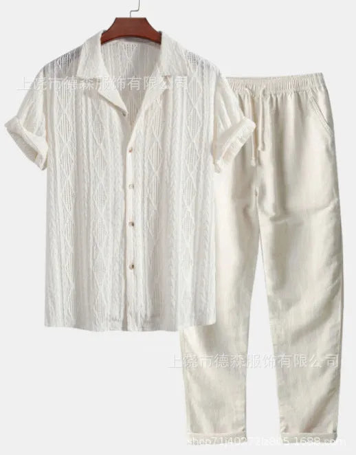 Man wearing a loose fit short sleeve shirt and matching trousers in a light colour, a summer casual suit.