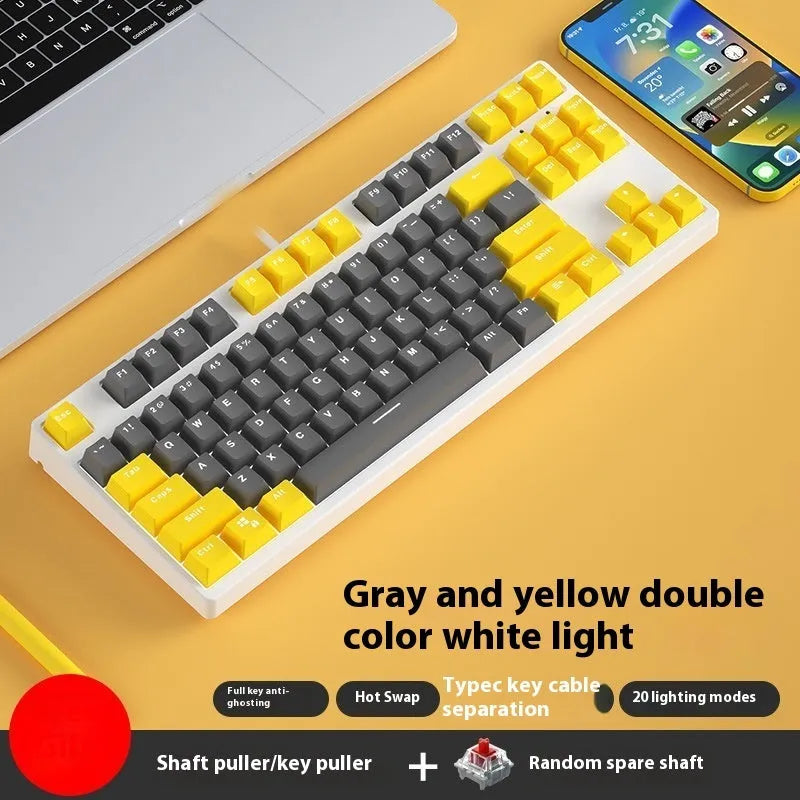 87 key wired mechanical keyboard with metal chassis shown in a black, orange, and yellow colour configuration.