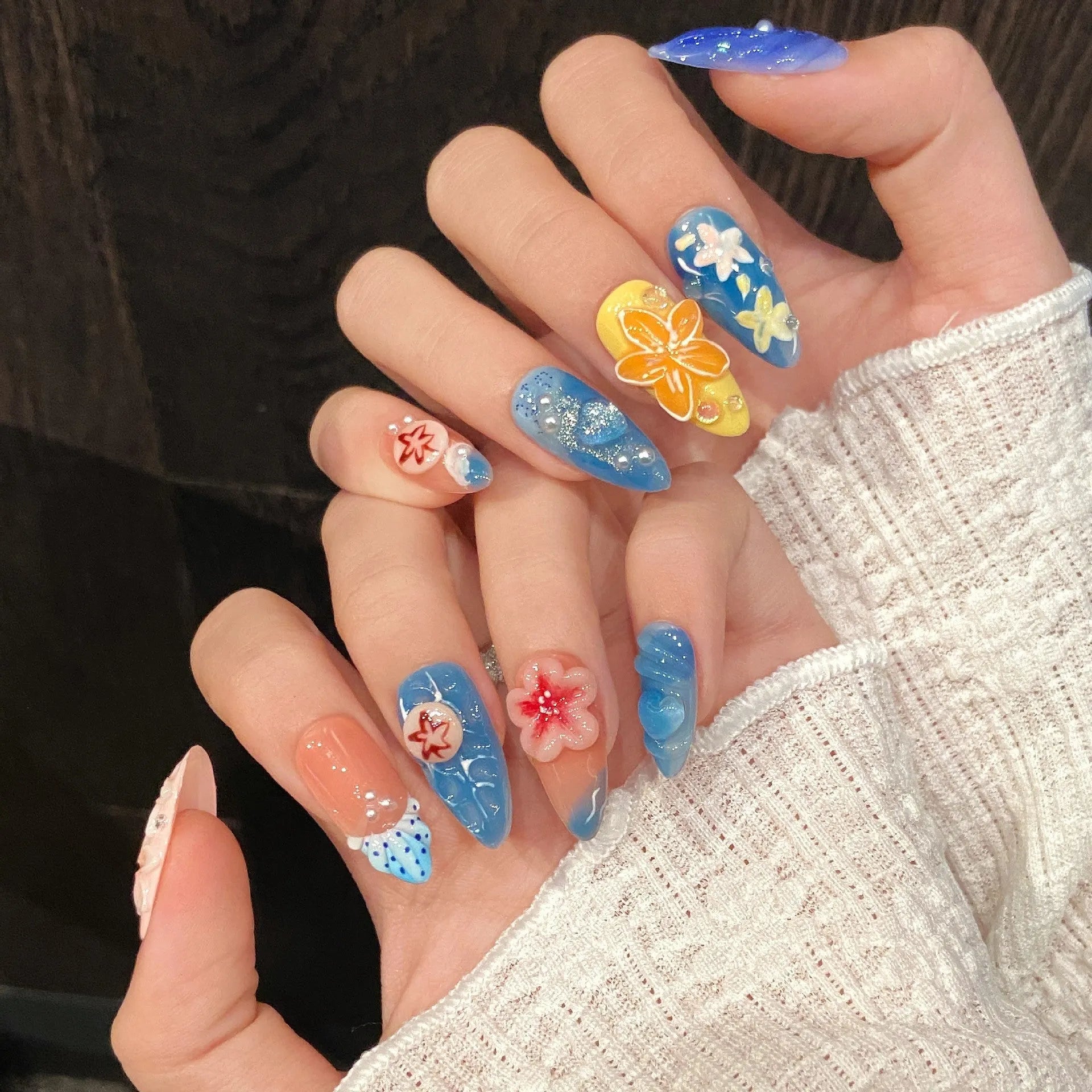 Three-dimensional carved jellyfish plastic wearable armour set in almond nail colour with marine patterns