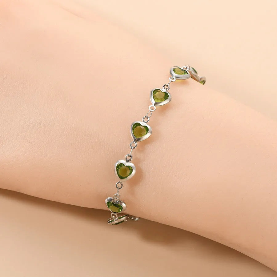 Devil's Eye geometric heart bracelet in stainless steel, shown in colourful, blue, green, or red electroplated finish