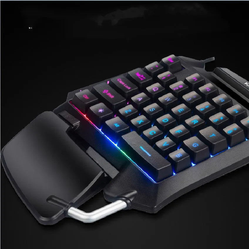 Black one-handed throne converter gaming keyboard with USB cable and integrated palm rest for left-hand desktop gaming