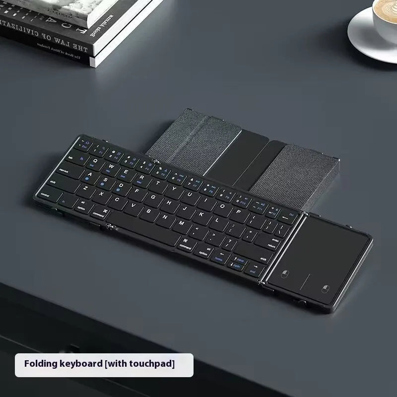 Black folding Bluetooth keyboard with either touchpad or digital board accessory for mobile phones and tablets