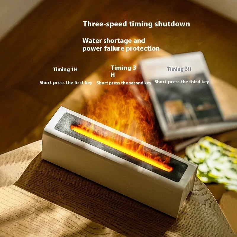Black square USB aroma diffuser humidifier with colour-changing flame LED light and water tank on a wooden table.