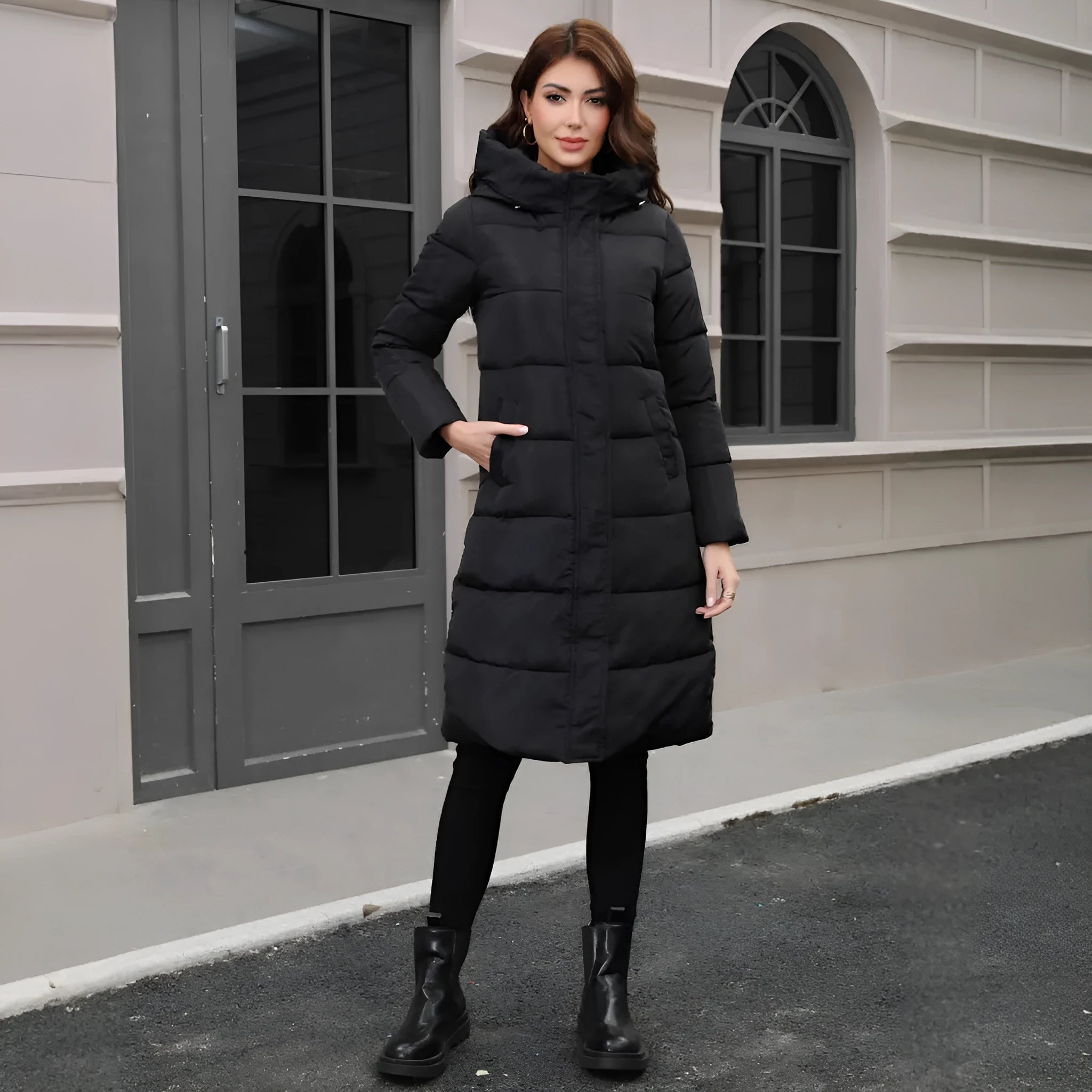 Black hooded slim fit long winter jacket for men on a hanger
