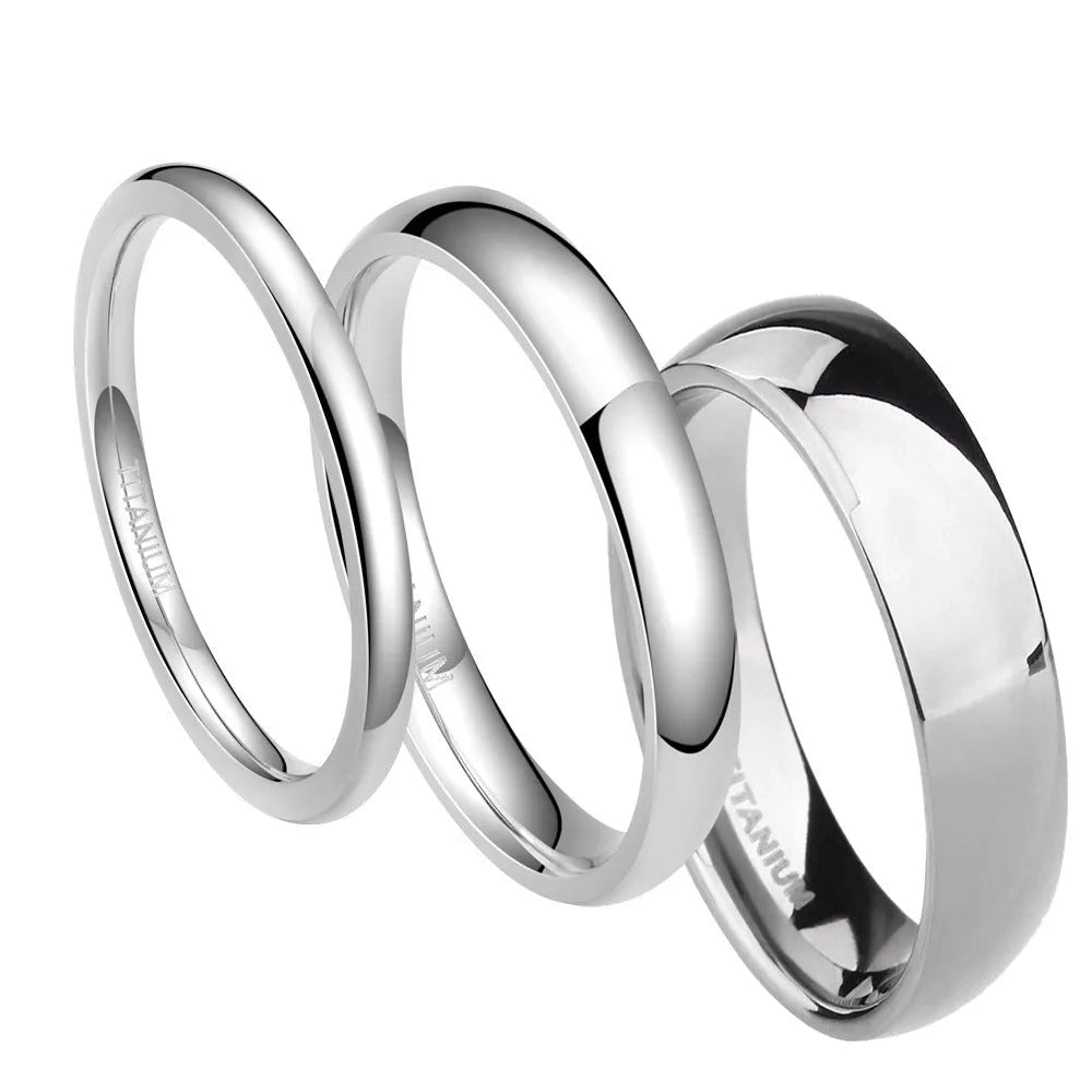 Silver titanium steel ring on a plain background showing its simple band design and grinding finish