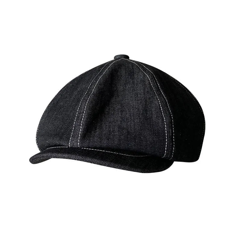 Black cotton beret with an octagonal cap style on a neutral background.