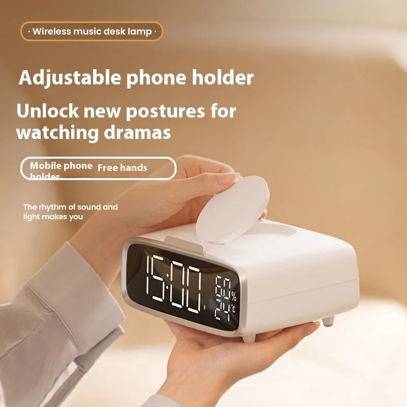 White Bluetooth speaker with wireless charging pad and integrated night lamp