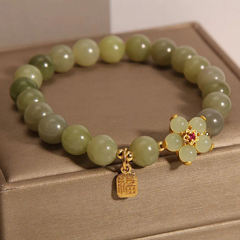 A grey jade coloured alloy bracelet with a casual style for women.
