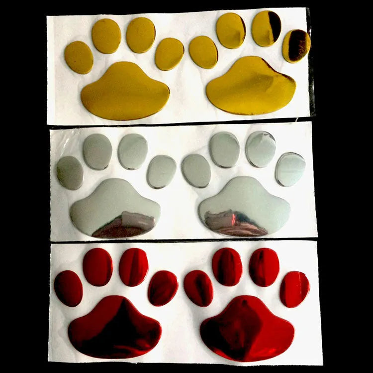 PVC car bumper sticker with hand-brushed dog footprints pattern in red, silver, gold, or black, 7cm long.
